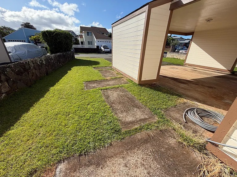 Walkway from driveway, front side yard, carport closet