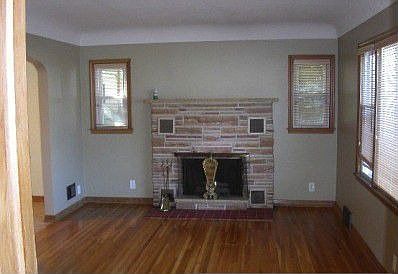 Gas Fireplace and refinished hardwood floors in living room