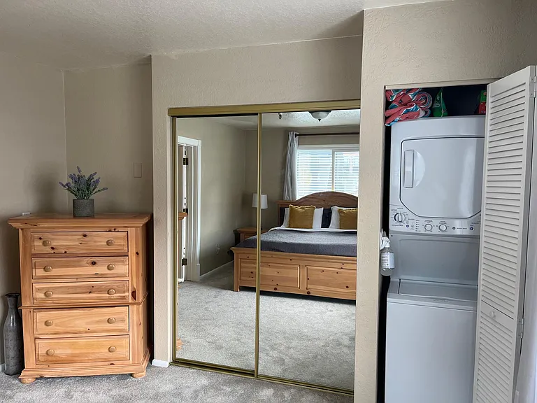 Bedroom closet, washer and dryer and dresser