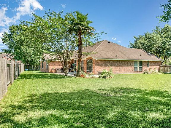 Back yard is a true cul de sac lot with wide side yards. Left side yard in the back yard is pictured here. Plenty of room for children to run and play, pet space and even gardening!