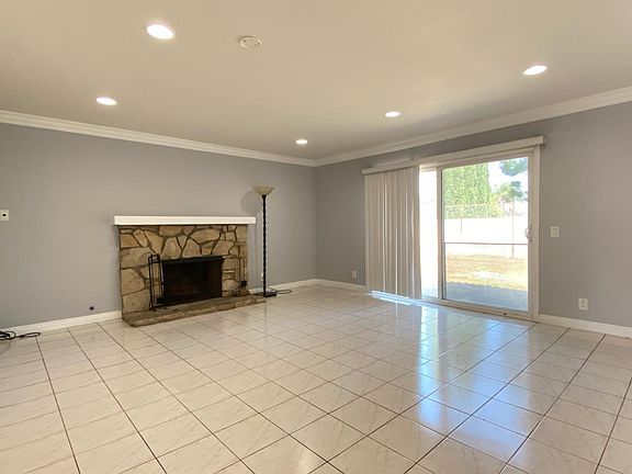 Bright and Spacious Living Room with recess lighting and ceramic tile flooring