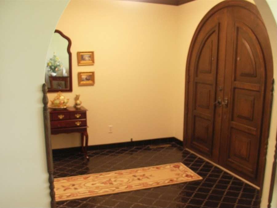 "Large entry with slate black tiles."