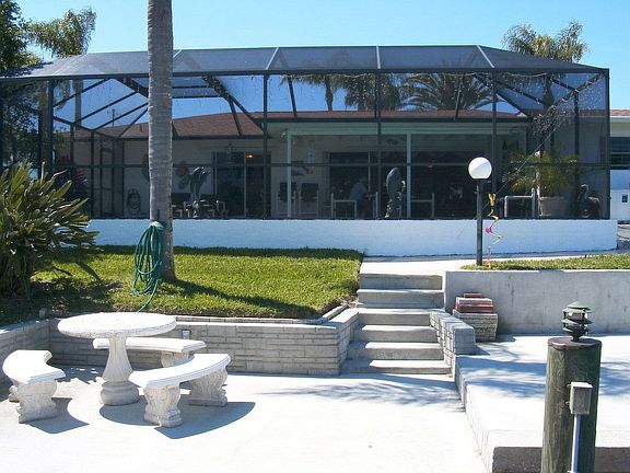 Pool with new cage, patio, davit etc.