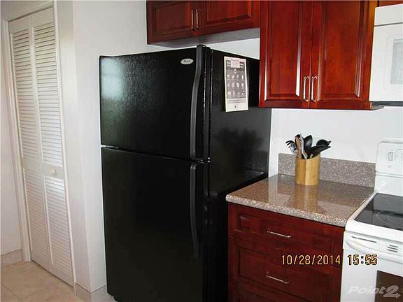 Newer appliances and granite countertops in upgraded kitchen