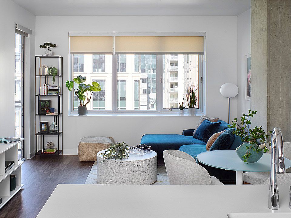 Apartment living room with wood-style flooring.