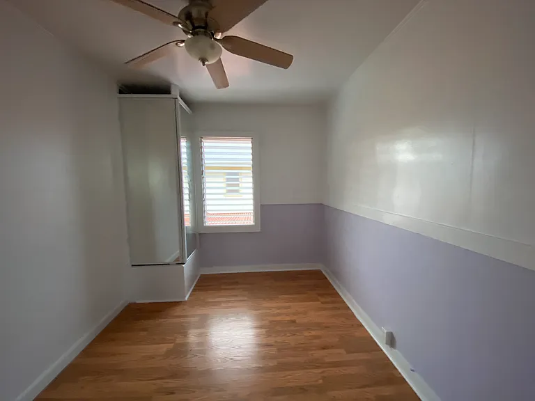 Middle purple bedroom off the living room