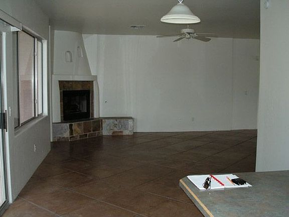 Living/dining room with corner fireplace
