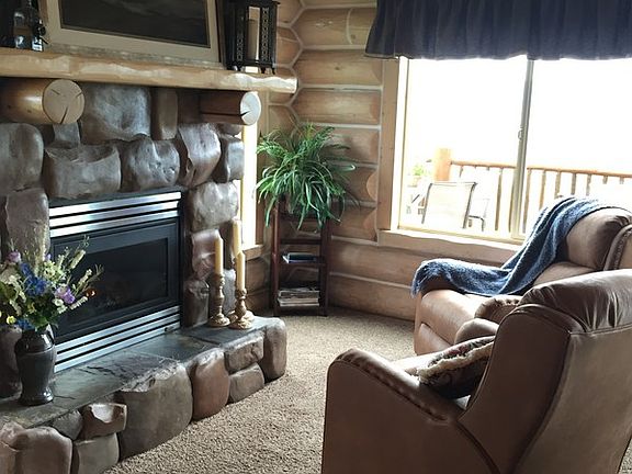 Rock Fireplace : Natural gas fireplace makes a warm and inviting seating area