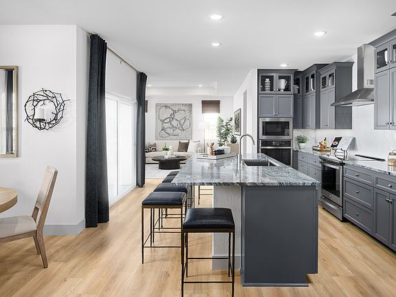 Kitchen with wood flooring and gorgeous cabinets