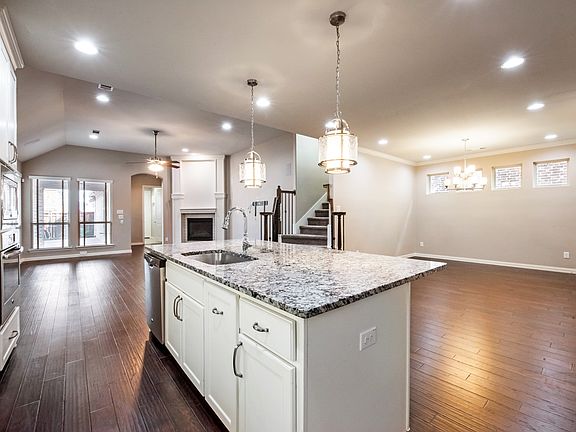 Kitchen looking to dining room and living room
