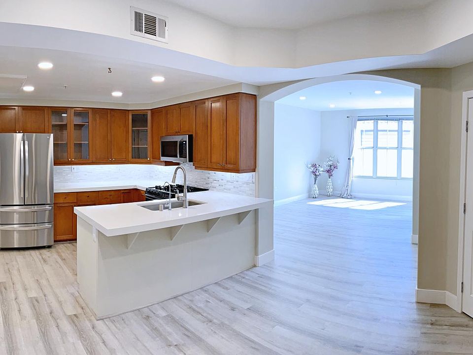 Modern, spacious open design connecting the kitchen to dinning area and living area.