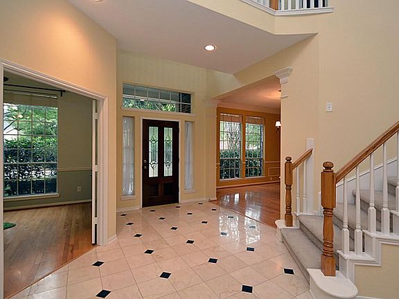 As you enter the home is a beautiful foyer with beautifully accented tile.