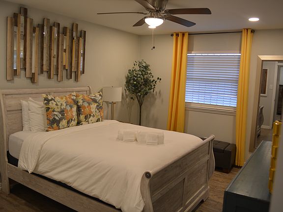 Bedroom 1 - a queen bed, smart tv and attached to bathroom 2.