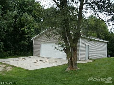 32 x 32 garage with large cement approach was built in 2007 and has door opener.