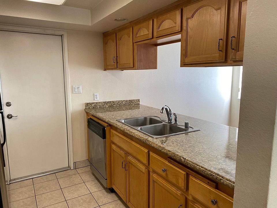 Plenty of Granite Counter top space for serving your favorite dishes. Includes Extra Deep Stainless Steel sink with High Arch faucets - makes washing larger pots and pans a breeze. Includes convenient sprayer for quick rinse before putting in the dishwash