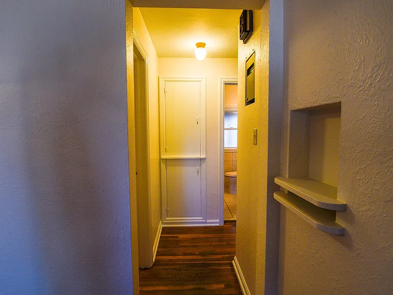 Additional linen closet around the corner and storage cupboards in hallway. First door to left is 1st bedroom. Two additional bedrooms around the corner.