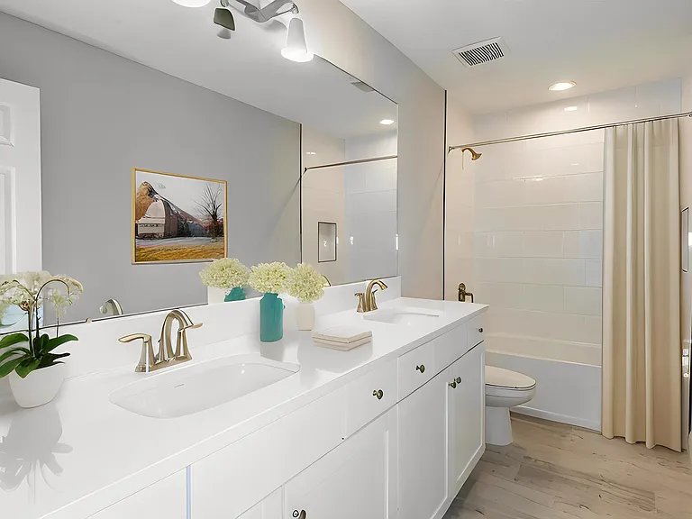 Second bathroom upstairs with double sinks.