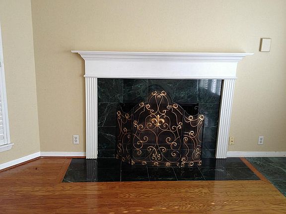 The fireplace is beautiful and features gaslogs.