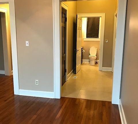 Bedroom looking into hall, bath apt 1