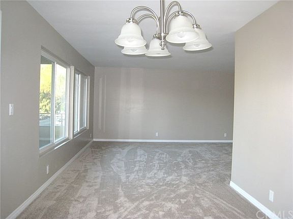 View from the Dining Room back to the Living room. Kitchen is to the right, balcony to the left.