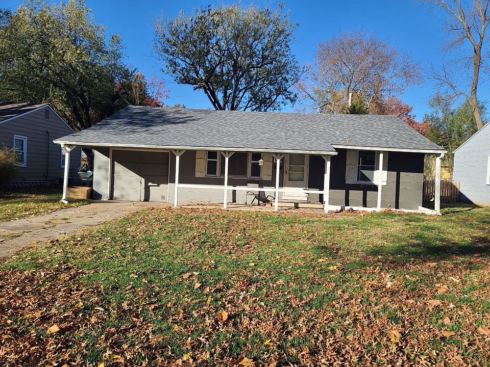 Front of the house. Covered porch. 
Single garage.