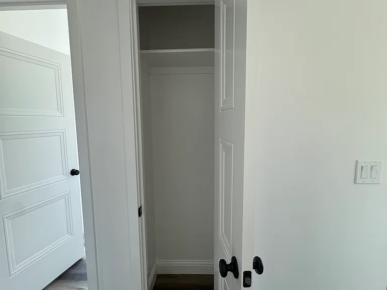 Utility closet next to indoor laundry room.