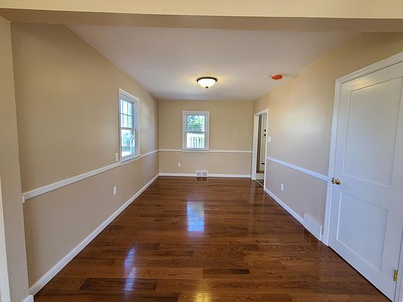A subtle archway separates the living room from the spacious dining room.