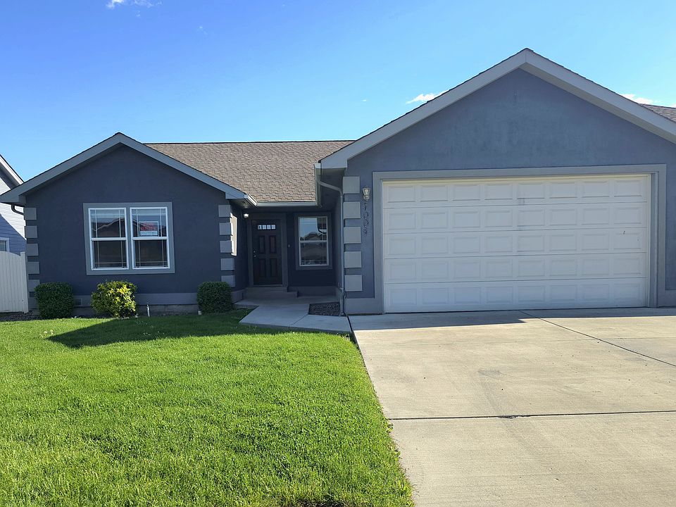 Front of Home; Common-wall house. Weekly lawn care included in rent.