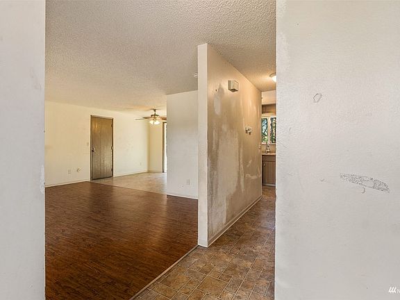 entryway looking into living room and  hallway >