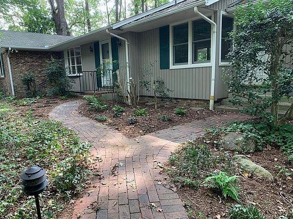 Brick path leads to side door and front door