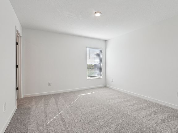Rest and relaxation await in the master bedroom