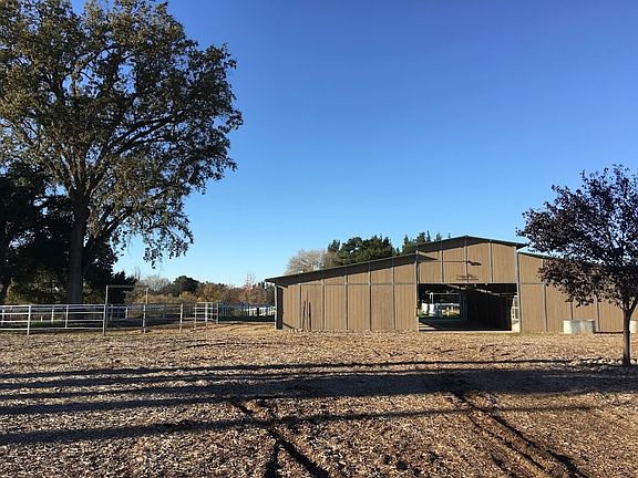 8 stall barn with  2 enclosed tack rooms. Stalls are 12x24 with self waters and misters.