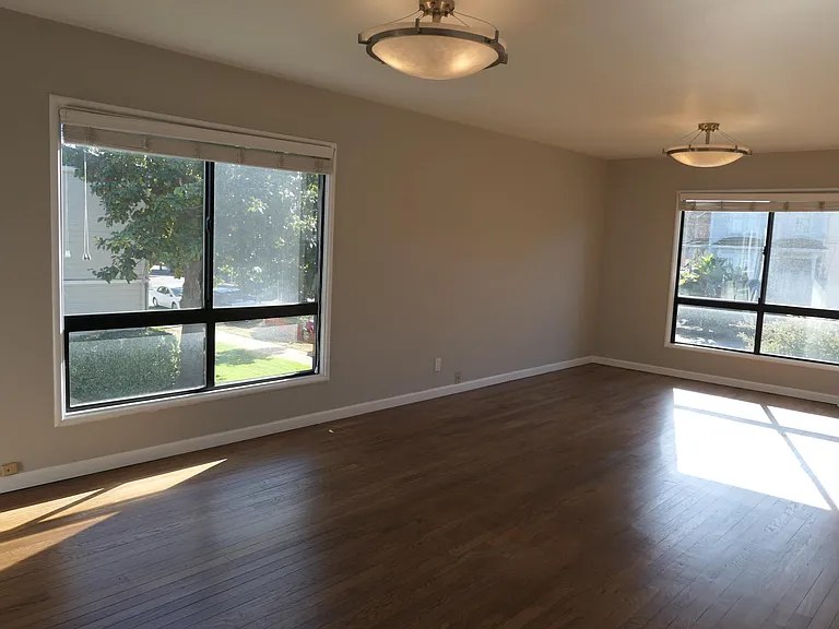 Lovely, spacious Living Room with Tongue and groove wood floors