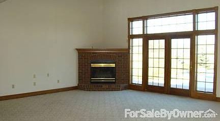 Living room
						:
						Large living area, complete with fire place and doors exiting to back deck/pool.