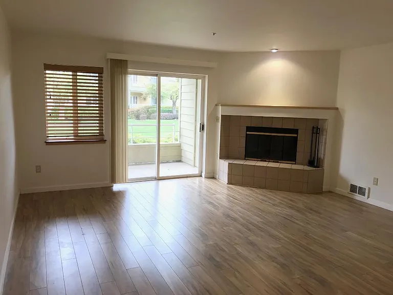 Front living room, looking onto deck overlooking courtyard and Columbia River beyond.