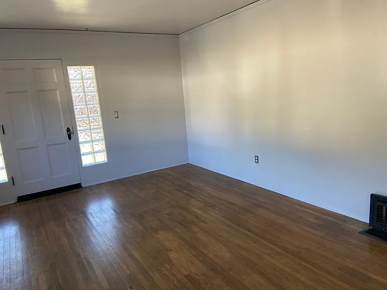 Living room with new glass blocks and floor heater.
