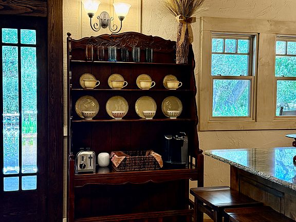 The breakfast hutch is equipped with a Keurig coffee maker and a Cuisinart toaster. Everything is handy for making a quick breakfast or bedtime tea.