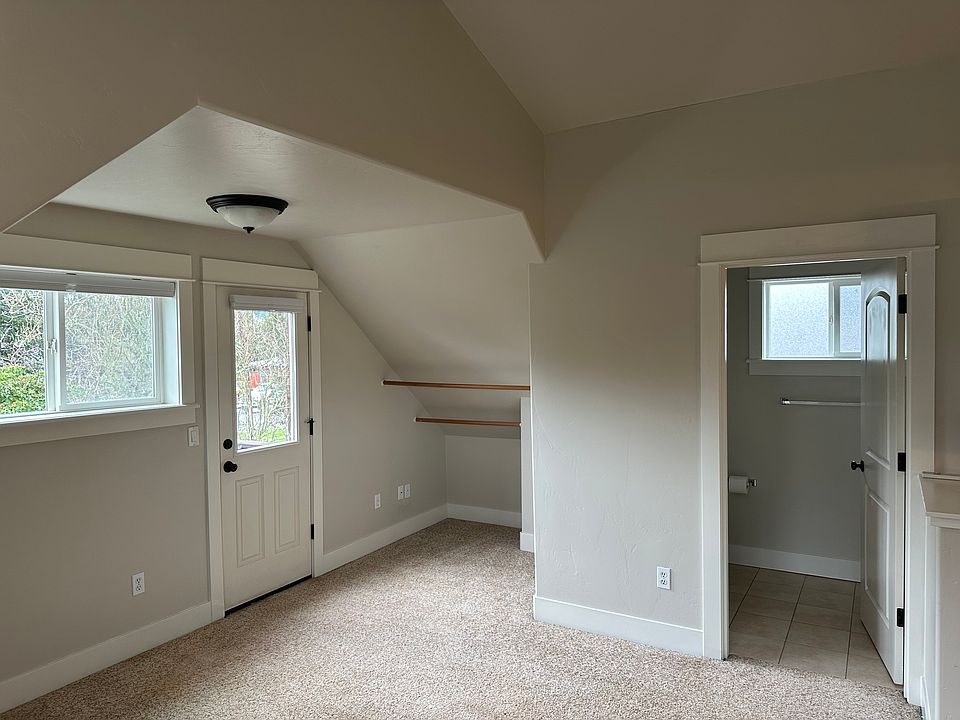 Room showing bathroom, closet, and door to balcony