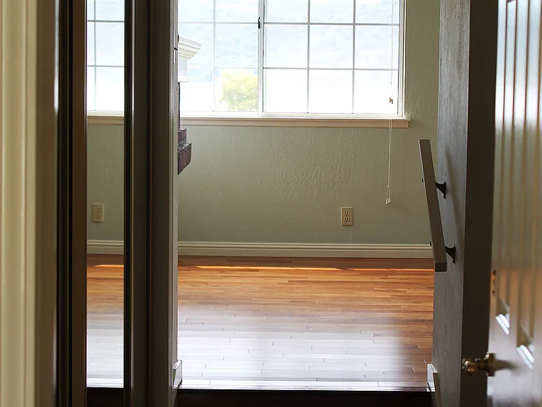 View past closet and master bath through to master bedroom