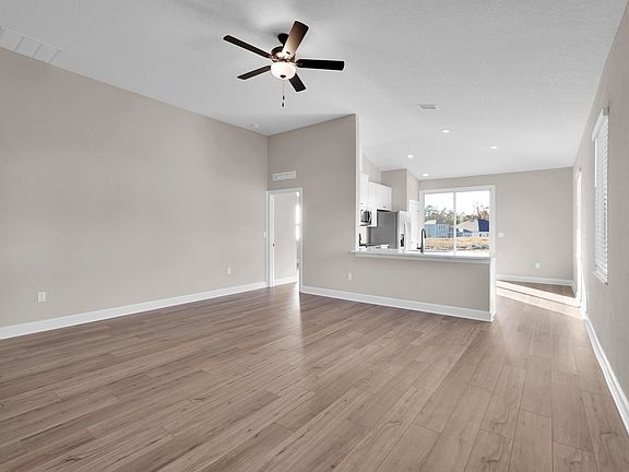 The open-layout seamlessly connects living spaces, perfect for entertaining and convenience.