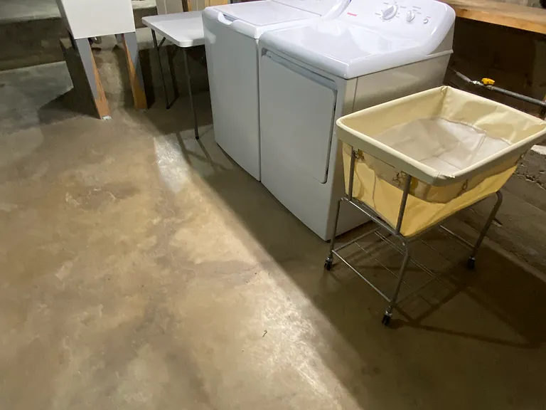 laundry room has ~ 300 sq ft of storage space.
New 50 gal water heater, washer, dryer, and utility sink.