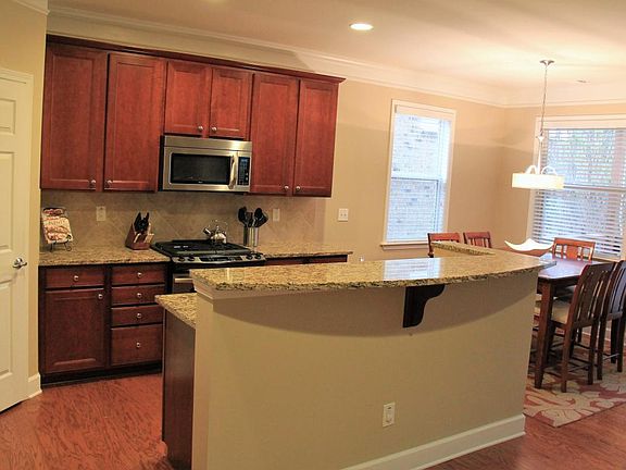 Open kitchen with spacious pantry, large center island, gran