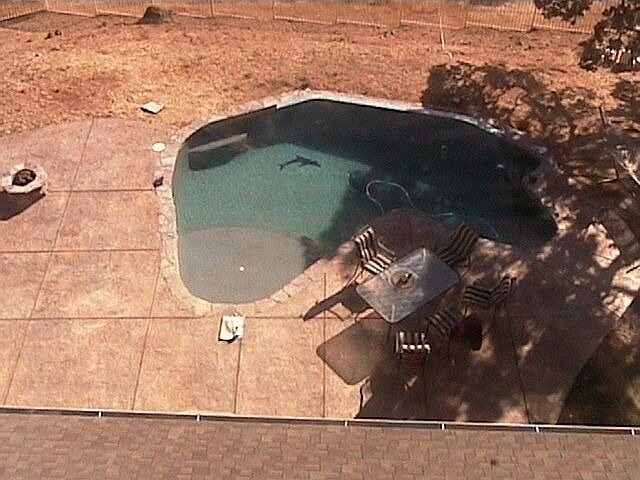 Negative edge pool, fire pit on left side of pictu