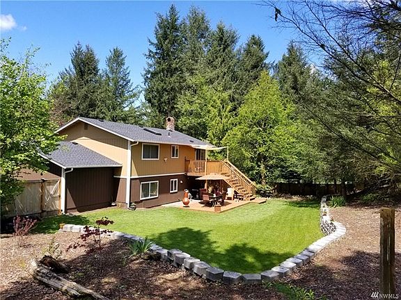 What a great backyard!  Privacy with room to play and garden! Upper and lower sundecks plus side patio.  The backyard is completely fenced.