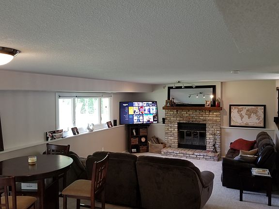 Wood burning fireplace in den