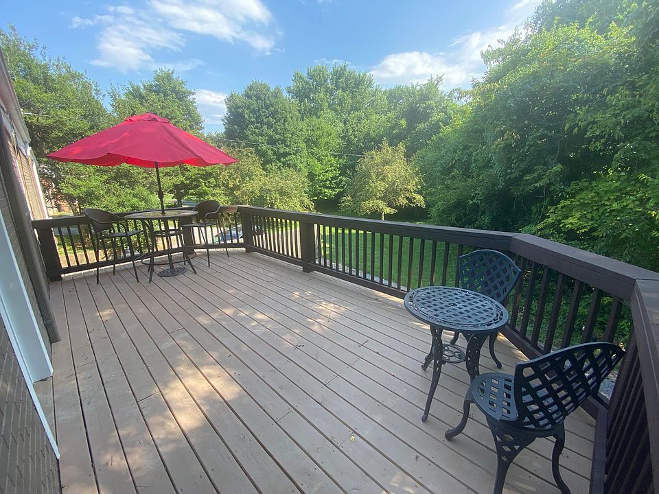 Grand Balcony overlooking private tree-lined back yard