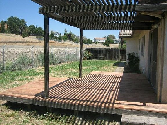 Covered patio w/ decking is perfect for summer BBQ's!