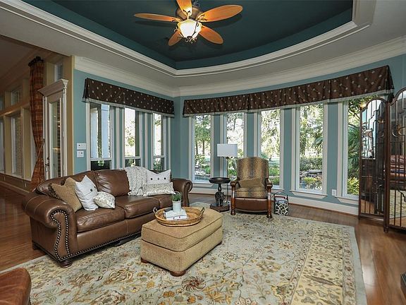 Game room or second living off the family room! Overlooks Pool and Golf Course with wet bar and beverage refrigerator! Great for entertaining!