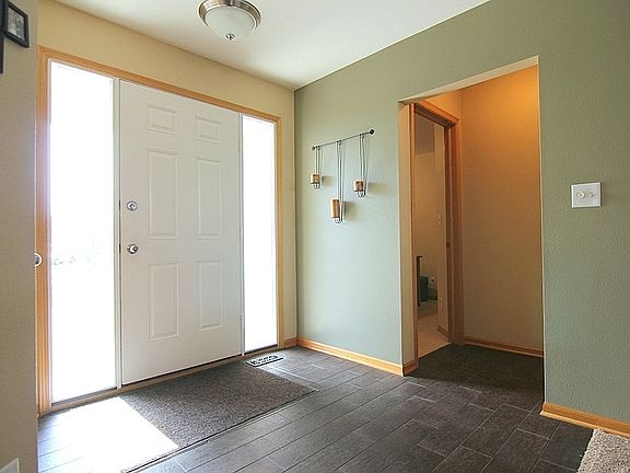 Large Front Entry with Dark Rectangular Tile Flooring