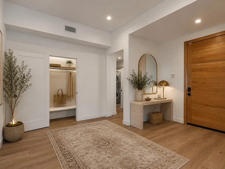 This is the front entrance door with coat hanging and shoe storage closet. The front door has multiple options for access including, keyed access, keypad or phone app.